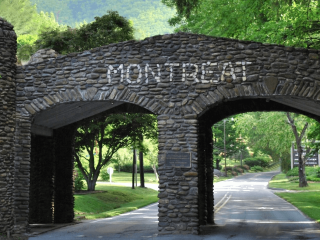 Picture is of Montreat College gate it is a stone gate with the word Montreat in White paint at the top.