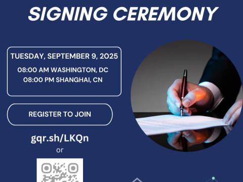 Cermony information and photo of a hand signing