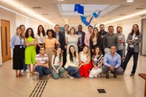 Group of students and teachers posing for a picture at one of the simulation competition sites.