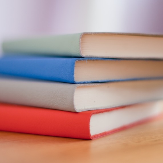 four books on table